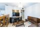 Bright room featuring a vintage cabinet, tile floors, and entertainment setup at 6445 W Windsor Blvd, Glendale, AZ 85301