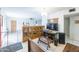 Bright room featuring a vintage cabinet, tile floors, and entertainment setup at 6445 W Windsor Blvd, Glendale, AZ 85301