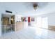 A spacious room with tile floors, white walls, and large windows for natural light at 6445 W Windsor Blvd, Glendale, AZ 85301