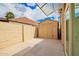 Enclosed backyard area with a shed, concrete patio, and ample room for storage at 6908 W Sunnyside Dr, Peoria, AZ 85345