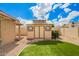 View of outdoor shed featuring a metal roof and double door in a well-maintained yard at 6908 W Sunnyside Dr, Peoria, AZ 85345