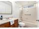 Well-lit bathroom featuring a tub, shower, and marble countertop vanity at 6908 W Sunnyside Dr, Peoria, AZ 85345