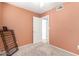 Bedroom with neutral colored walls and carpet and wire shelving at 6908 W Sunnyside Dr, Peoria, AZ 85345