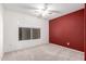 Bedroom boasts carpet floors, natural light, and a ceiling fan at 6908 W Sunnyside Dr, Peoria, AZ 85345