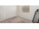 Bedroom features neutral carpeting, a window, and a closet at 6908 W Sunnyside Dr, Peoria, AZ 85345