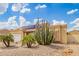 Single-story home features solar panels and low-maintenance desert landscaping, with cacti and palm trees at 6908 W Sunnyside Dr, Peoria, AZ 85345