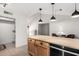 Kitchen featuring a central island, wood cabinets, and stainless steel appliances offers culinary potential at 6908 W Sunnyside Dr, Peoria, AZ 85345
