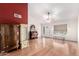 Open living room with hardwood floors, vaulted ceilings, and a bright, airy feel at 6908 W Sunnyside Dr, Peoria, AZ 85345