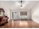Bright living room with hardwood floors and lots of natural light streaming through the windows at 6908 W Sunnyside Dr, Peoria, AZ 85345