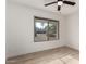 Light-filled bedroom featuring wood floors and a view out the window at 7125 N 23Rd Ave, Phoenix, AZ 85021
