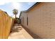 Exterior featuring a long sidewalk, brick walls, and a privacy fence at 7125 N 23Rd Ave, Phoenix, AZ 85021