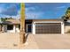 Charming home featuring a two-car garage, xeriscaped yard, and a lovely Saguaro cactus at 7125 N 23Rd Ave, Phoenix, AZ 85021