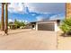 Traditional home boasting a spacious driveway, xeriscaped yard, and a two-car garage at 7125 N 23Rd Ave, Phoenix, AZ 85021