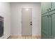 Hallway with door, storage and wood look floors at 7125 N 23Rd Ave, Phoenix, AZ 85021