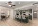 Open concept kitchen featuring stainless steel appliances, a breakfast bar, and modern finishes at 7125 N 23Rd Ave, Phoenix, AZ 85021
