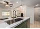 Bright kitchen with a large sink, quartz countertops, and stainless steel appliances at 7125 N 23Rd Ave, Phoenix, AZ 85021