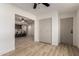 Open-concept living area with wood-look flooring and a view into the updated kitchen at 7125 N 23Rd Ave, Phoenix, AZ 85021