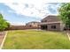 Expansive backyard featuring a lush lawn and a covered patio, perfect for outdoor entertaining and relaxation at 7342 S Debra Dr, Gilbert, AZ 85298