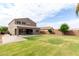 Expansive backyard featuring a manicured lawn and covered patio at 7342 S Debra Dr, Gilbert, AZ 85298