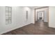 Bedroom with wood-style tile flooring and wood beam entryway at 7342 S Debra Dr, Gilbert, AZ 85298