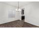 Dining room with wood-style flooring and modern chandelier at 7342 S Debra Dr, Gilbert, AZ 85298