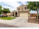 Charming two-story home with a well-manicured lawn and a spacious two-car garage at 7342 S Debra Dr, Gilbert, AZ 85298