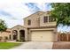 Charming two-story home with a well-manicured lawn and a spacious two-car garage at 7342 S Debra Dr, Gilbert, AZ 85298