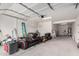 Spacious garage with storage shelving, a water heater, and ample space for parking and storage at 7342 S Debra Dr, Gilbert, AZ 85298