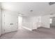 Upstairs hallway with carpeted floors and white walls, featuring a double door closet and staircase at 7342 S Debra Dr, Gilbert, AZ 85298