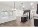 Well-lit kitchen featuring stainless steel appliances and a granite-topped center island at 7342 S Debra Dr, Gilbert, AZ 85298