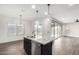 Kitchen island with granite countertops and stainless steel sink with pendant lighting above at 7342 S Debra Dr, Gilbert, AZ 85298