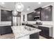 Gourmet kitchen with granite countertops, stainless steel appliances, and dark cabinetry at 7342 S Debra Dr, Gilbert, AZ 85298