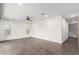 Living room featuring wood-look floors, neutral paint, ceiling fan, and natural light at 7342 S Debra Dr, Gilbert, AZ 85298