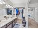 Bright bathroom features a dual sink vanity and access to the walk-in closet at 7949 W Pershing Ave, Peoria, AZ 85381