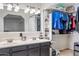 Bright bathroom features a dual sink vanity and access to the walk-in closet at 7949 W Pershing Ave, Peoria, AZ 85381
