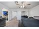 Comfortable bedroom with carpeted flooring, ceiling fan, walk-in closet, and stylish furnishings at 7949 W Pershing Ave, Peoria, AZ 85381