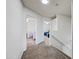 Upstairs hallway with carpet flooring leading to rooms with ceiling fans at 7949 W Pershing Ave, Peoria, AZ 85381