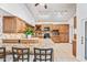 Bright kitchen features wooden cabinetry, granite countertops, and stainless steel appliances at 7949 W Pershing Ave, Peoria, AZ 85381