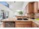 The kitchen sink has granite countertops, stylish cabinets, and stainless steel appliances at 7949 W Pershing Ave, Peoria, AZ 85381