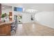 Spacious living room with tile flooring, bright windows, and access to the kitchen at 7949 W Pershing Ave, Peoria, AZ 85381