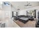 Bright living room featuring a large gray sectional, soaring ceilings, and natural light at 7949 W Pershing Ave, Peoria, AZ 85381