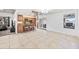The kitchen overlooks the open-concept living and dining area with tile floors and lots of light at 7949 W Pershing Ave, Peoria, AZ 85381