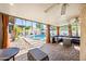 Covered patio with brick flooring, seating and a view of the pool and backyard at 7949 W Pershing Ave, Peoria, AZ 85381