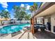 Backyard with a sparkling pool, covered patio, and a lounge area for outdoor enjoyment at 7949 W Pershing Ave, Peoria, AZ 85381