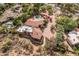 Aerial view showcasing the tile roof, sparkling pool, and lush landscaping of this beautiful estate at 8031 N 54Th St, Paradise Valley, AZ 85253