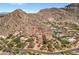 Breathtaking aerial view of estate, surrounded by desert landscape in a community with nearby amenities at 8031 N 54Th St, Paradise Valley, AZ 85253
