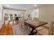 Bright dining room features a large wood table set on a patterned rug, with white brick arches in the background at 8031 N 54Th St, Paradise Valley, AZ 85253