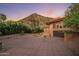 Home with a tile roof and arched windows, featuring a spacious garage and courtyard at 8031 N 54Th St, Paradise Valley, AZ 85253