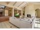 Inviting living room with a stone fireplace, vaulted ceiling, comfortable seating, and open staircase access at 8031 N 54Th St, Paradise Valley, AZ 85253
