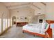 Spacious main bedroom boasts a fireplace, beamed ceilings, and a comfortable seating area, creating a relaxing retreat at 8031 N 54Th St, Paradise Valley, AZ 85253